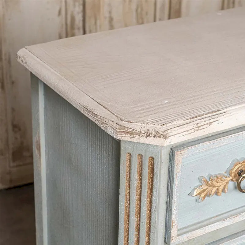 Meuble haut à 2 tiroirs en bois, couleur crème et bleu clair vieilli, avec des touches dorées